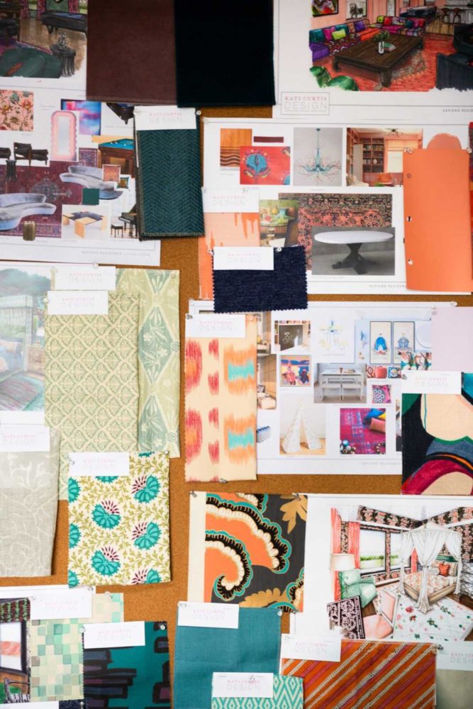 Colorful fabric swatches and interior design sketches on a corkboard